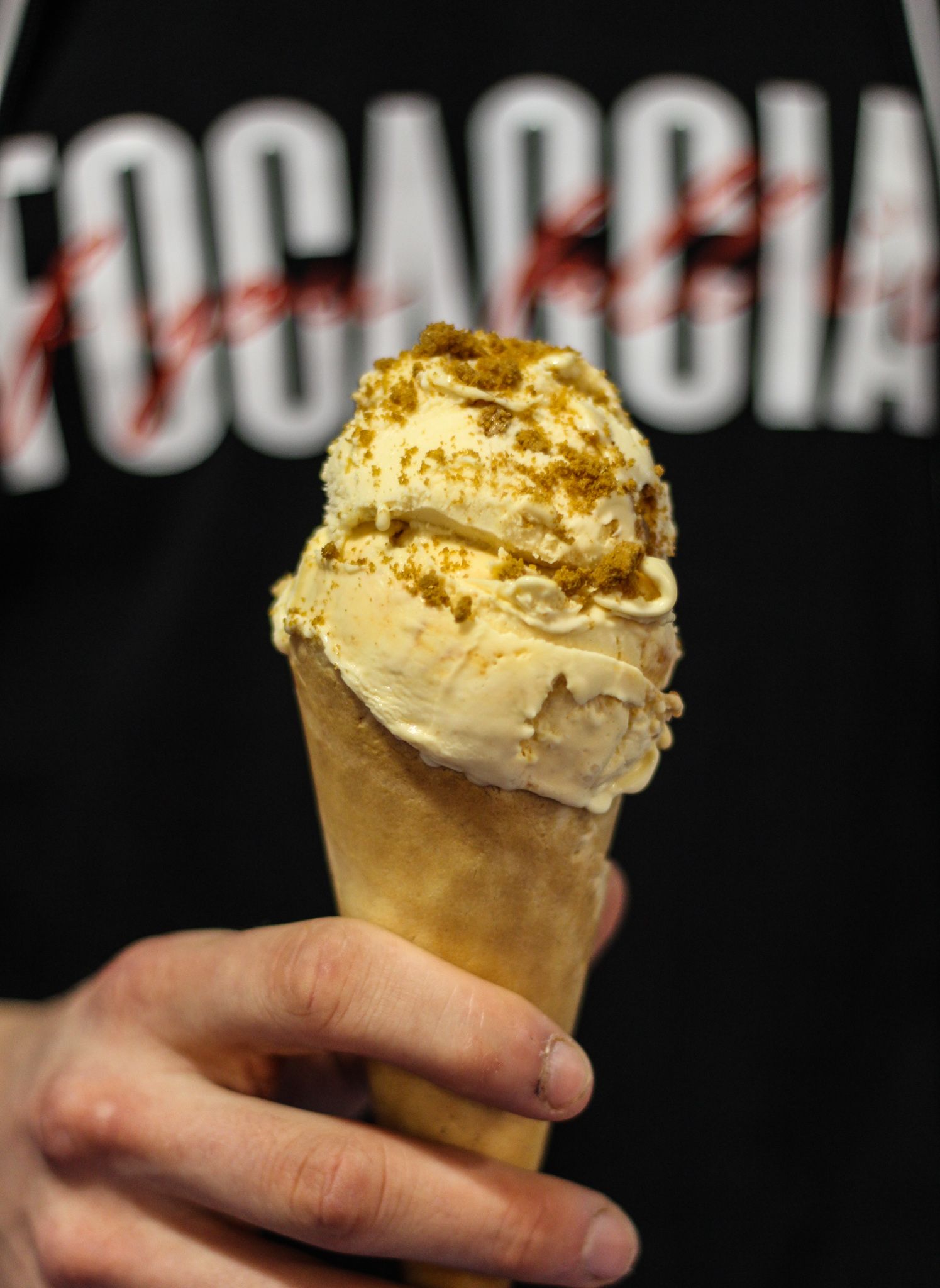 Close-up of ice cream cone with toppings ready to serve