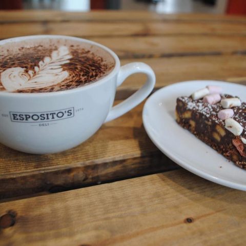 Carousel of Esposito’s ice cream flavours with cones and toppings