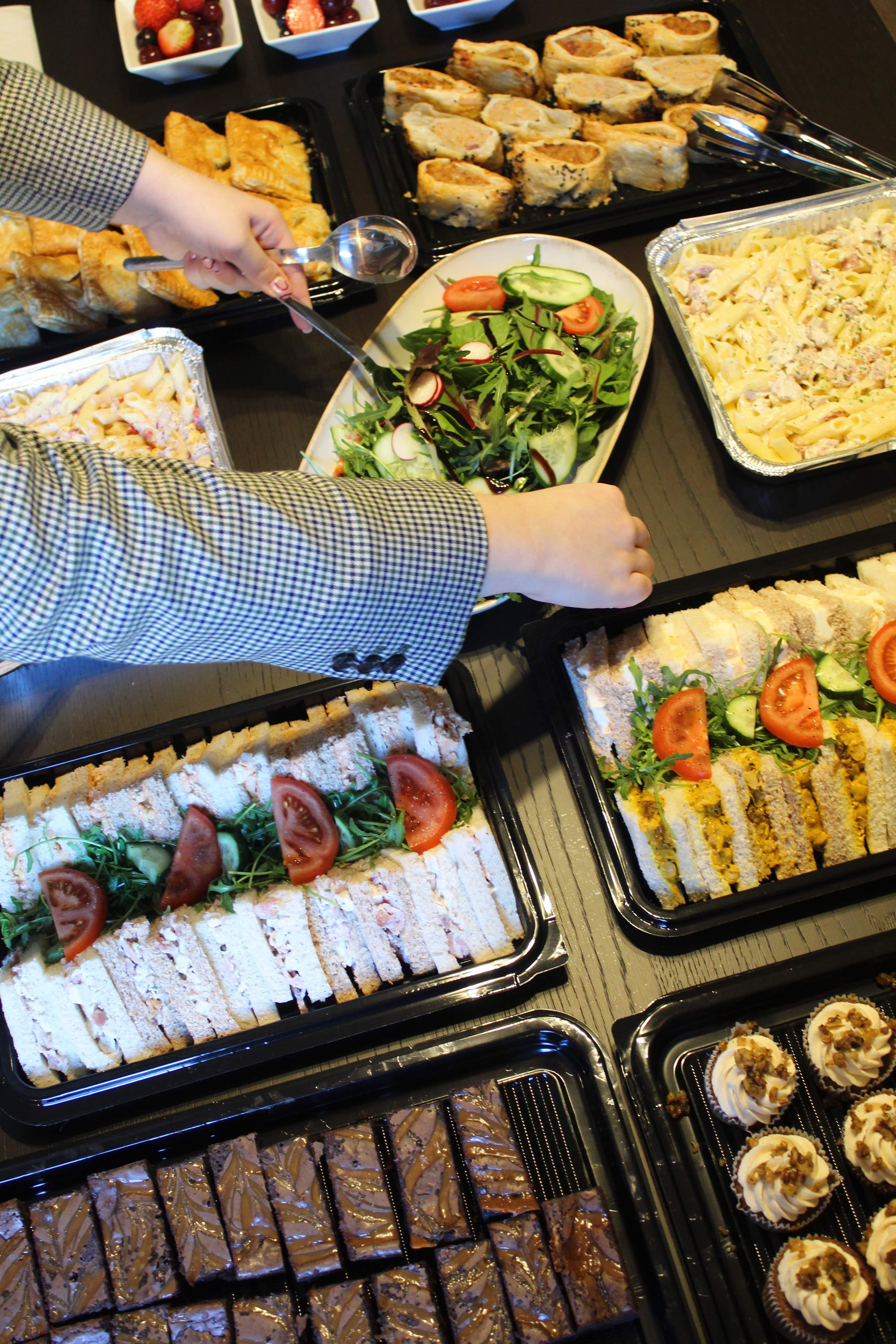 Close-up of a colorful ice cream sundae with sprinkles and chocolate sauce.