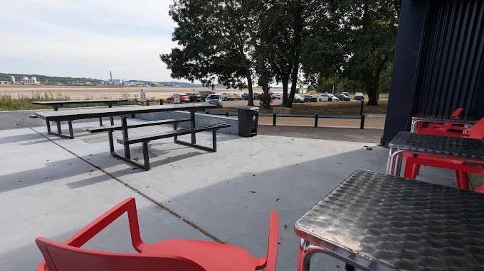 Outdoor seating area at Esposito's Pickering's Pasture beside the River Mersey