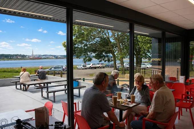 Customers enjoying food and drinks at Esposito's with views across the River Mersey